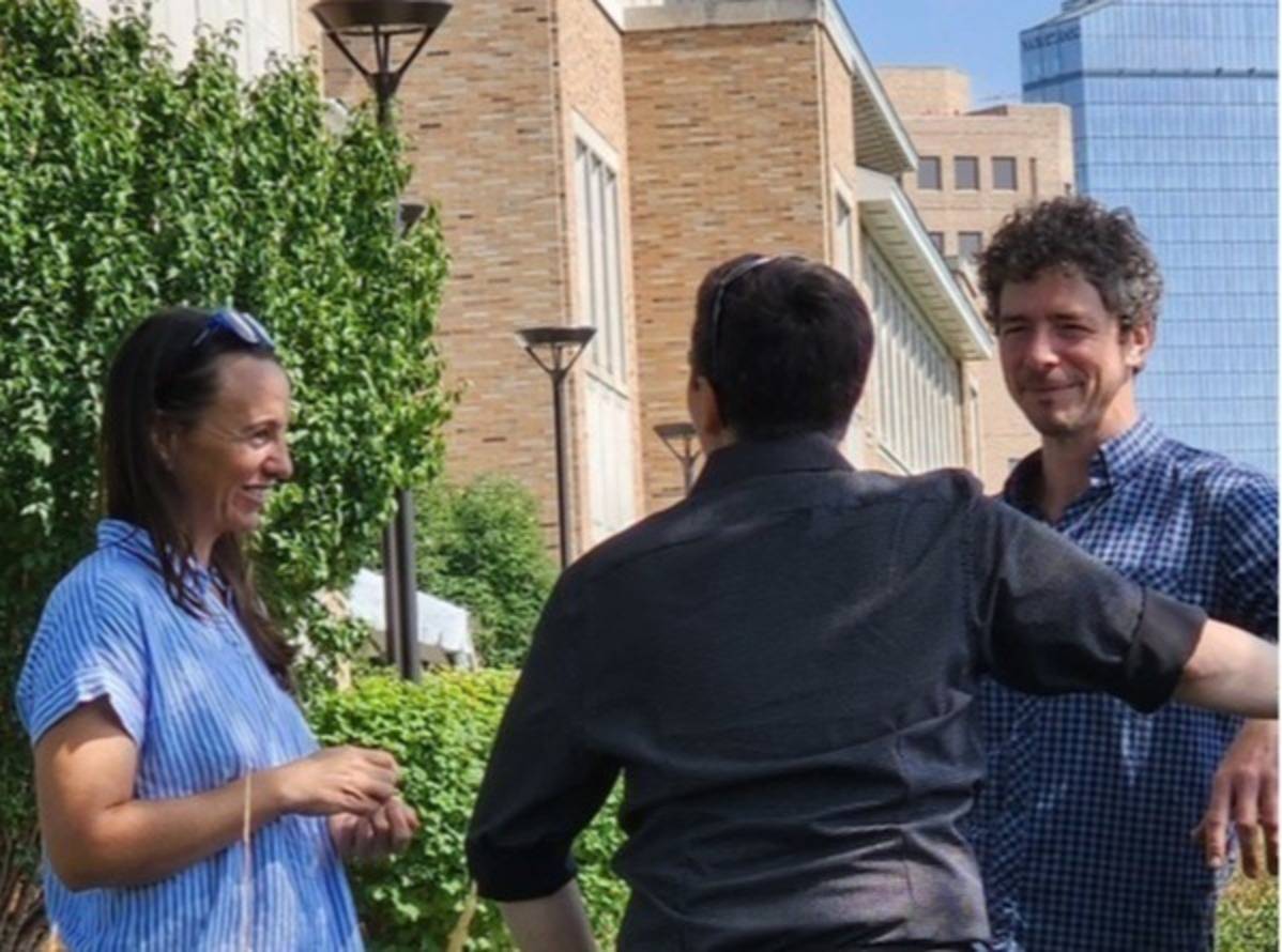 professors talking outside after the startup meeting